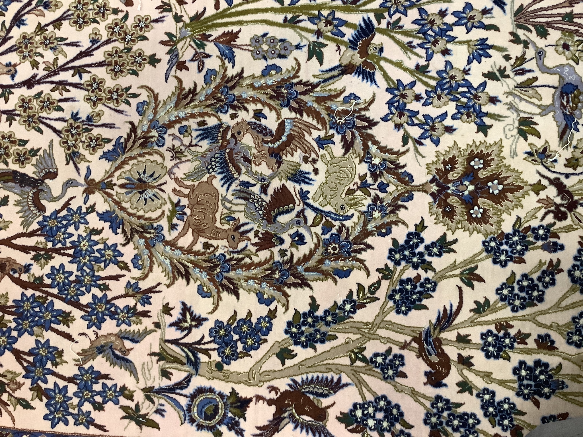 A Tabriz peach ground part silk pictorial rug, 180 x 111cm